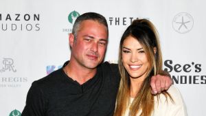 Taylor Kinney (L) and Ashley Cruger attend Operation Smile's 10th Annual Park City Ski Challenge Presented By The St. Regis Deer Valley & Deer Valley Resort at The St. Regis Deer Valley on April 02, 2022 in Park City, Utah