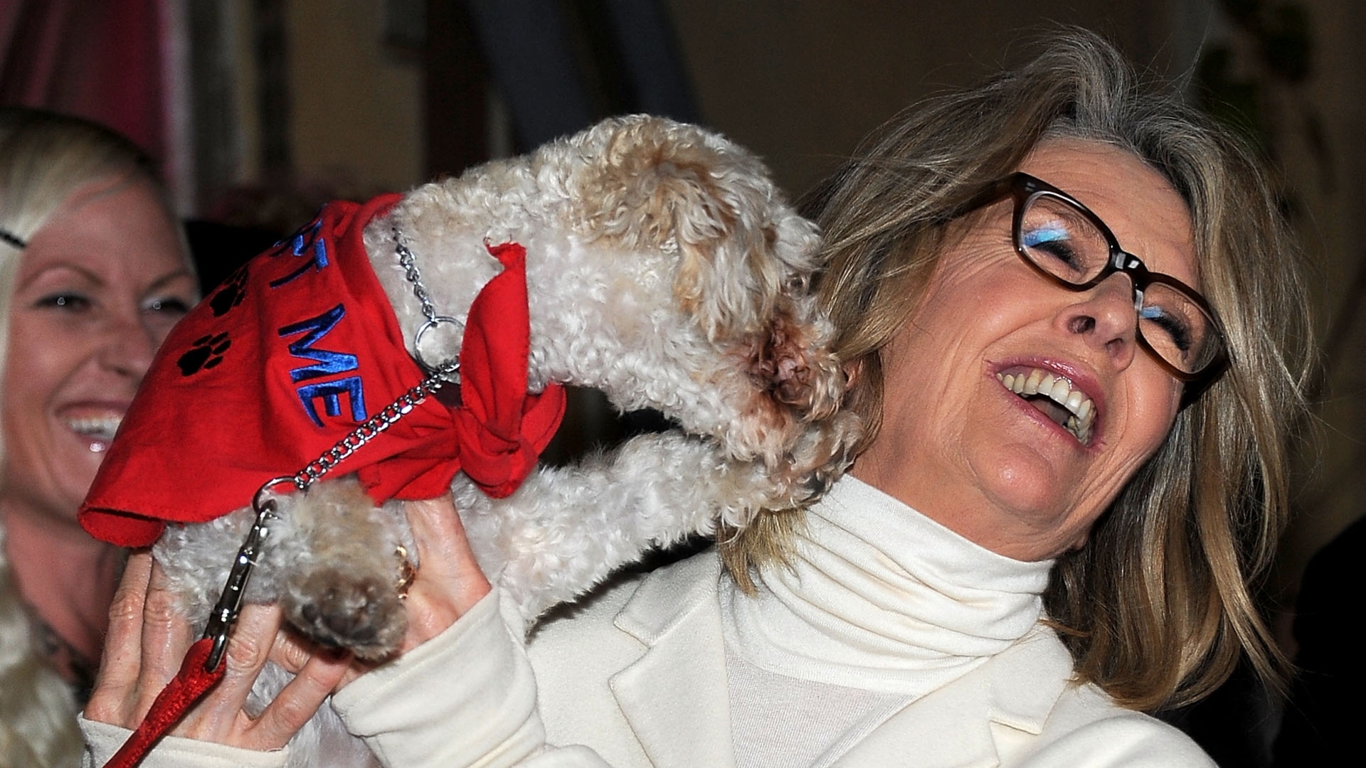 Diane Keaton posing with a dog