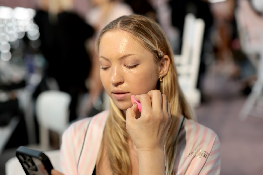 Lila Moss prepares backstage at the Victoria's Secret Fashion Show 2025
