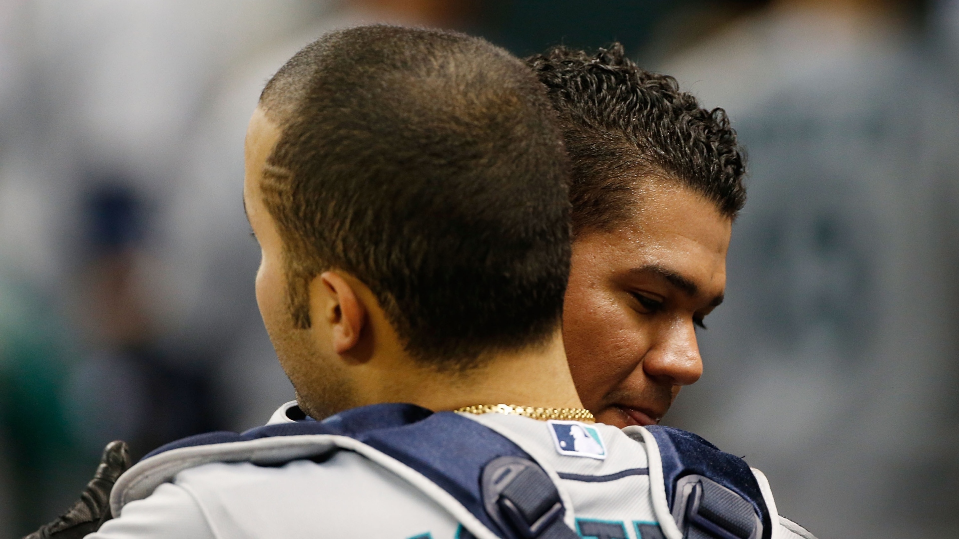 Jesus Montero embracing anoher player