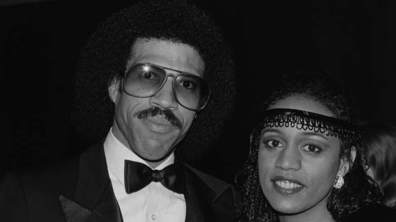 Lionel Richie and Brenda Harvey pose for photos