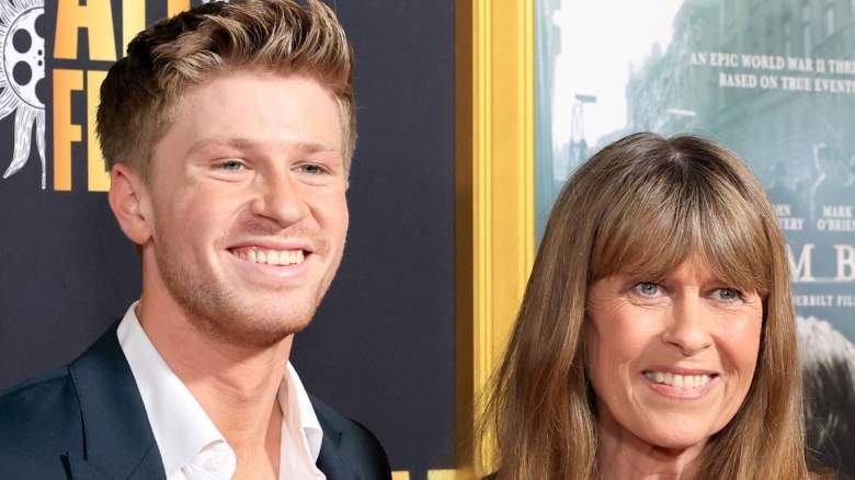 Robert Irwin and Terri Irwin smile for photos at an event