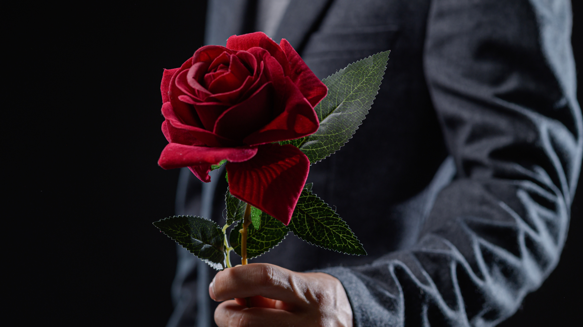 man holding a rose