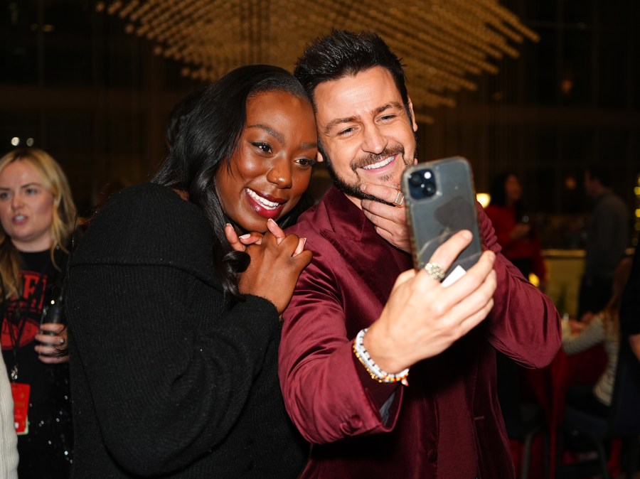 Tyler Hynes and Atipa Mobonga pose for a selfie