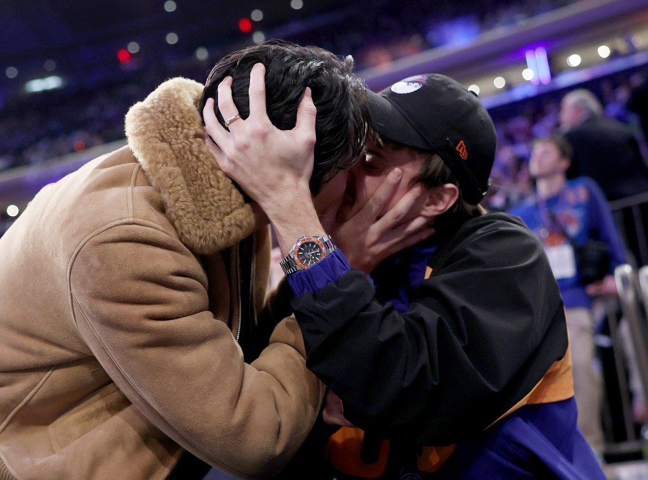 Chris Briney kissing Sean Kaufman