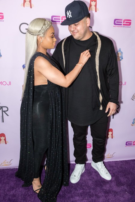 Blac Chyna and Rob Kardashian pose at an event