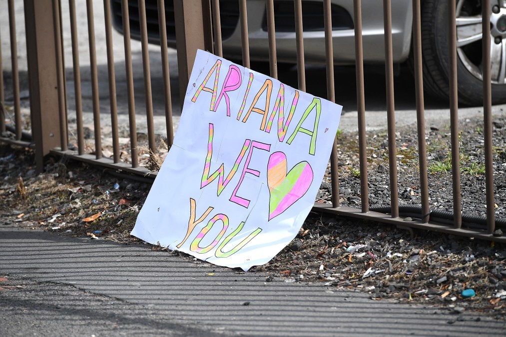 A sign saying 'Ariana we love you' is left in the street on May 23, 2017