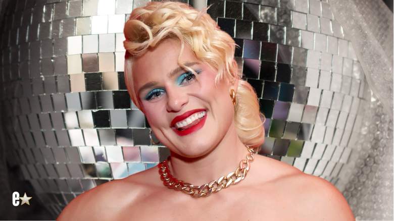 Ilona Maher smiles for photos with blonde hair