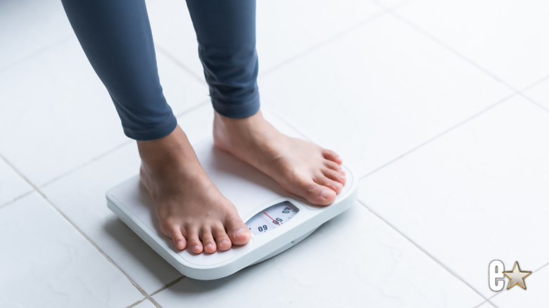 Woman standing on a scale