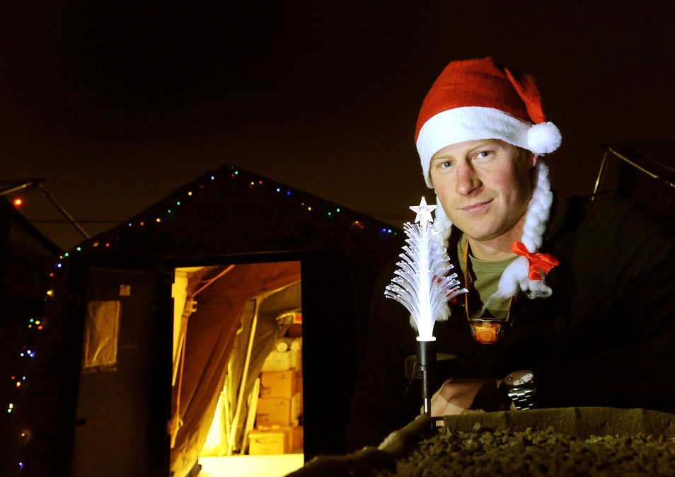 This picture taken on December 12, 2012 shows Britain's Prince Harry wearing a Christmas Hat 