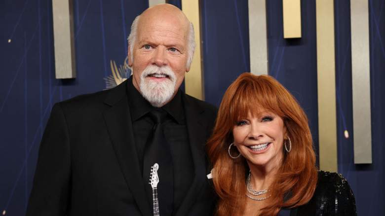 Reba McEntire (R) and Rex Linn arrive for the 77th Primetime Emmy Awards at the Peacock Theatre at LA Live in Los Angeles on September 14, 2025