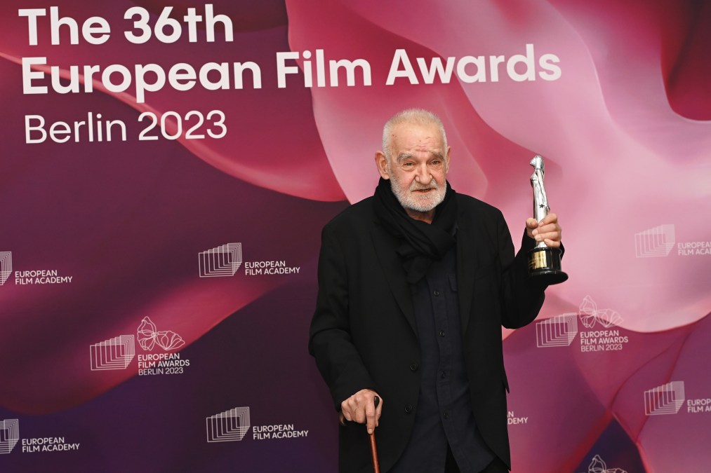 Béla Tarr holds his Honorary Award at the 36th European Film Awards in 2023