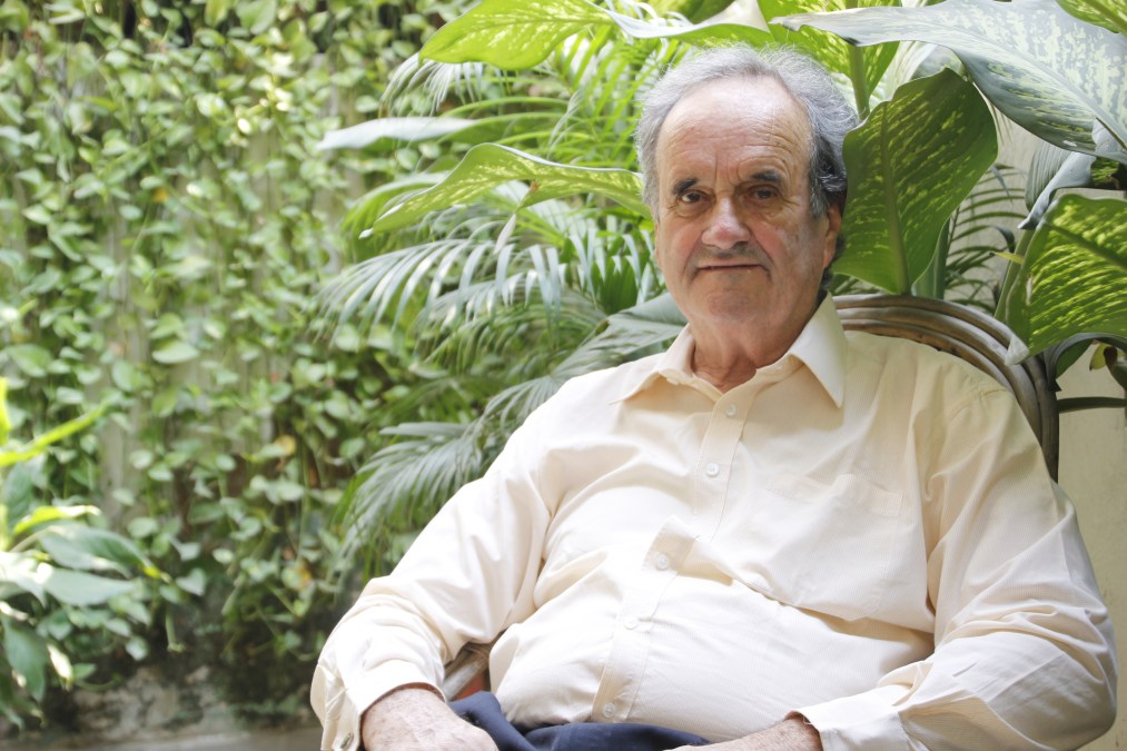 Sir William Mark Tully poses for a photo