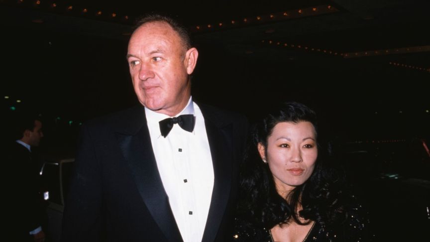 Gene Hackman, wearing a tuxedo and bow tie, and his partner, American pianist Betsy Arakawa, who wears a black-and-gold outfit, attend the 48th Golden Globe Awards at the Beverly Hilton Hotel in Beverly Hills
