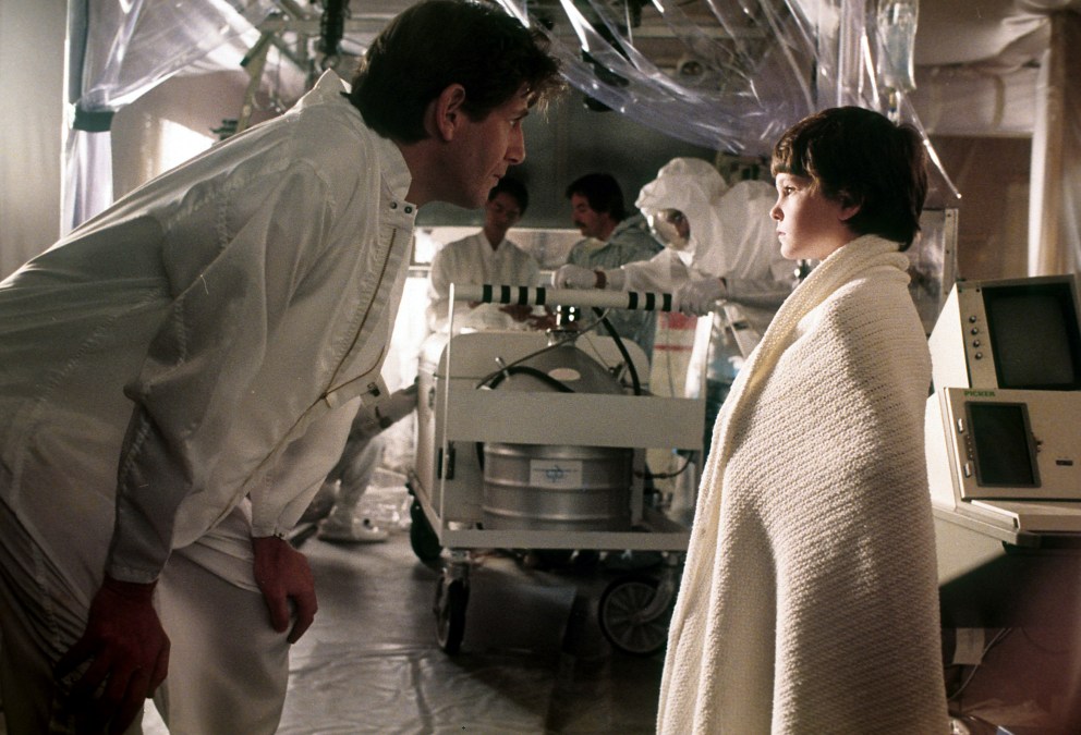 Peter Coyote (L) with Henry Thomas in "E.T. the Extra-Terrestrial" (1982).