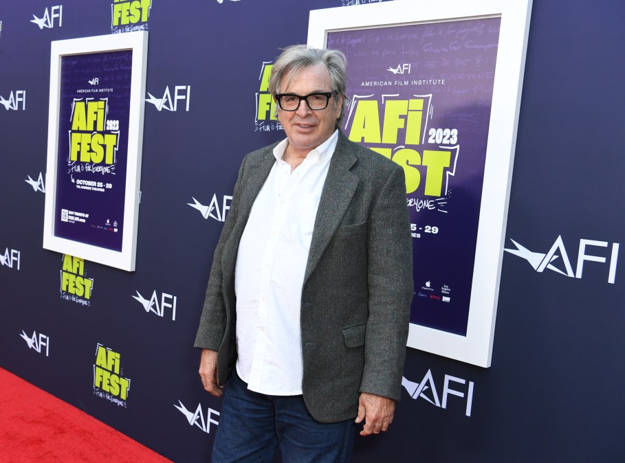 Robert Carradine poses for photos while attending an event 