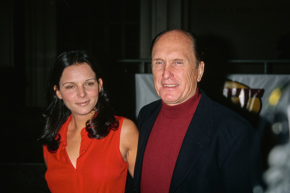 Argentine actress Luciana Pedraza, wearing a red outfit, and American actor Robert Duvall