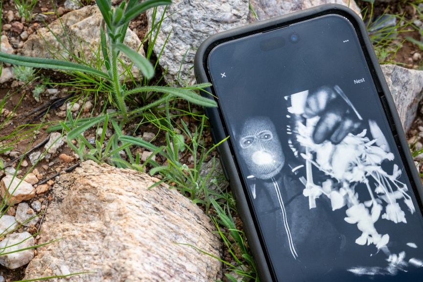 In this photo illustration, Nancy Guthrie's alleged kidnapper is seen on FBI Director Kash Patel's X account on a cellular phone February 10, 2026 in Tucson, Arizona.