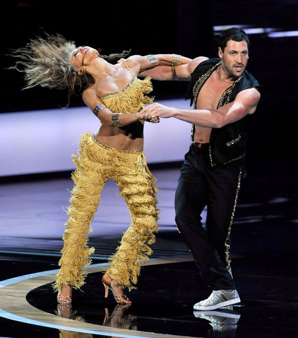Karina Smirnoff and Maksim Chmerkovskiy perform onstage during the 61st Primetime Emmy Awards