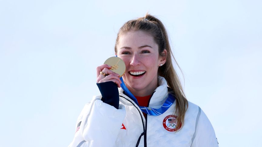 Gold medalist Mikaela Shiffrin of Team United States celebrates on the podium during the medal ceremony following the Women's Slalom Run on day twelve of the Milano Cortina 2026 Winter Olympics at Tofane Alpine Skiing Centre on February 18, 2026
