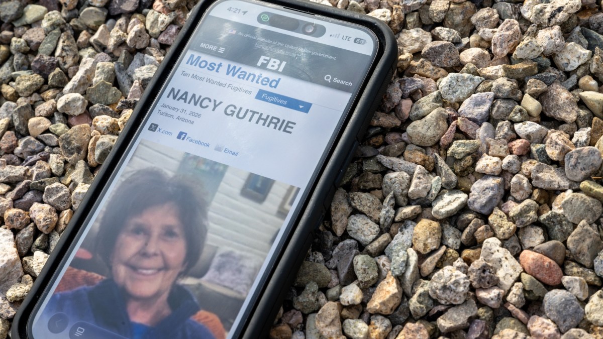 Nancy Guthrie missing poster on phone