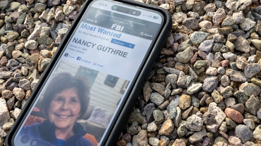 Nancy Guthrie missing poster on phone