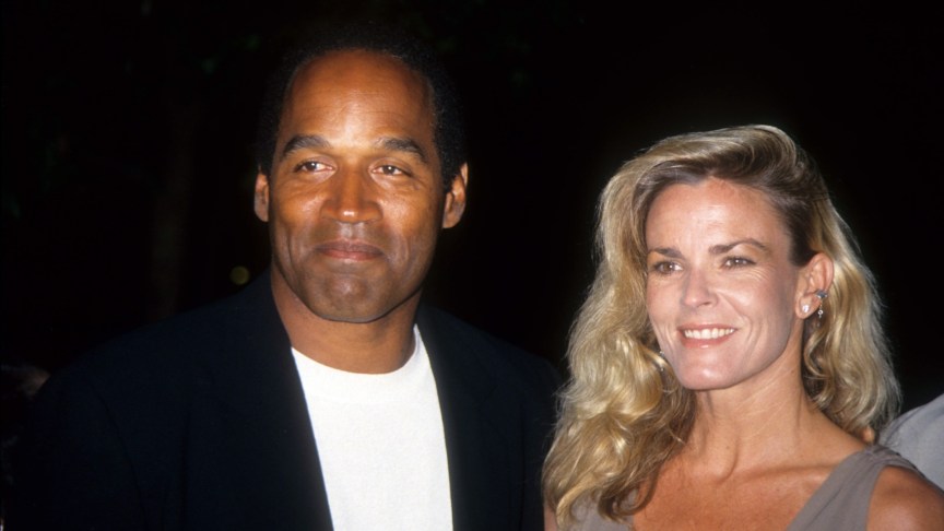 O.J. Simpson and Nicole Brown Simpson smiling for a photo