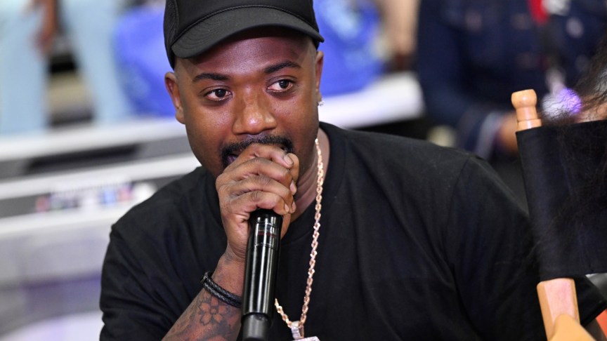 Ray J performing with a microphone