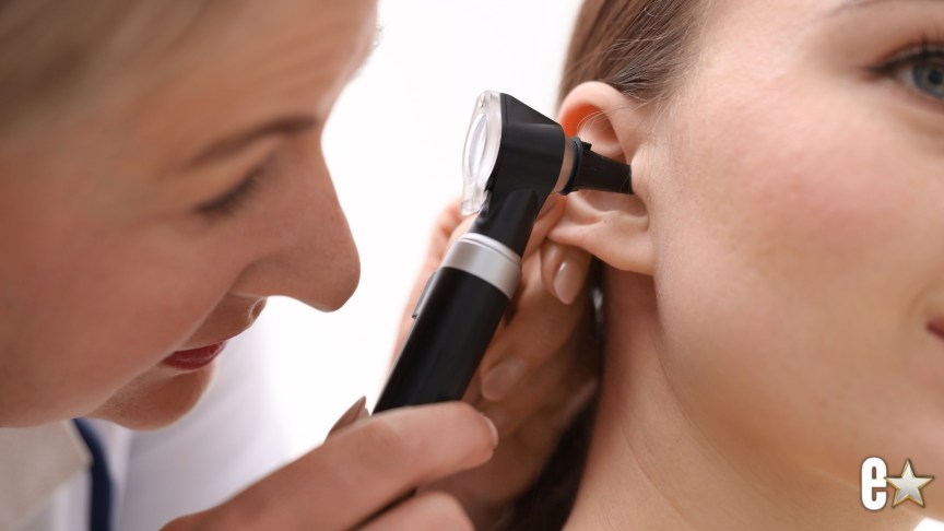 young woman having an ear examination