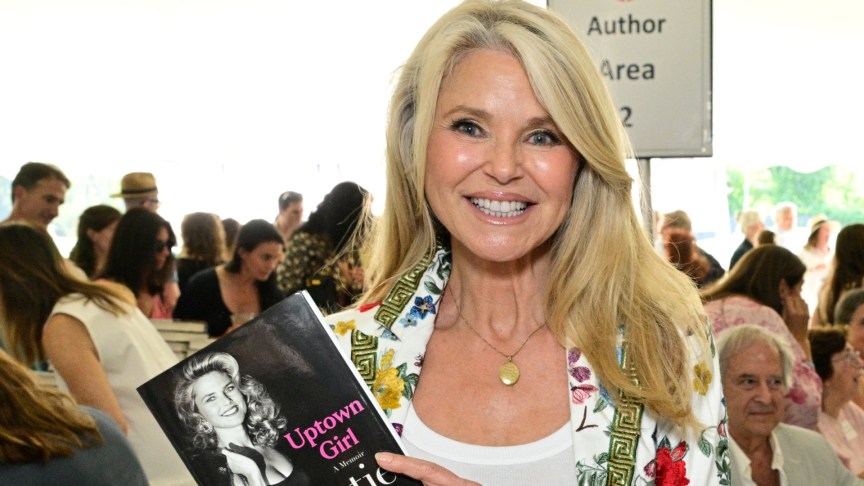 Christie Brinkley smiling at a book signing