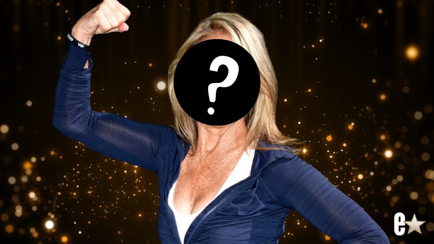 Denise Austin raising her arm in the air