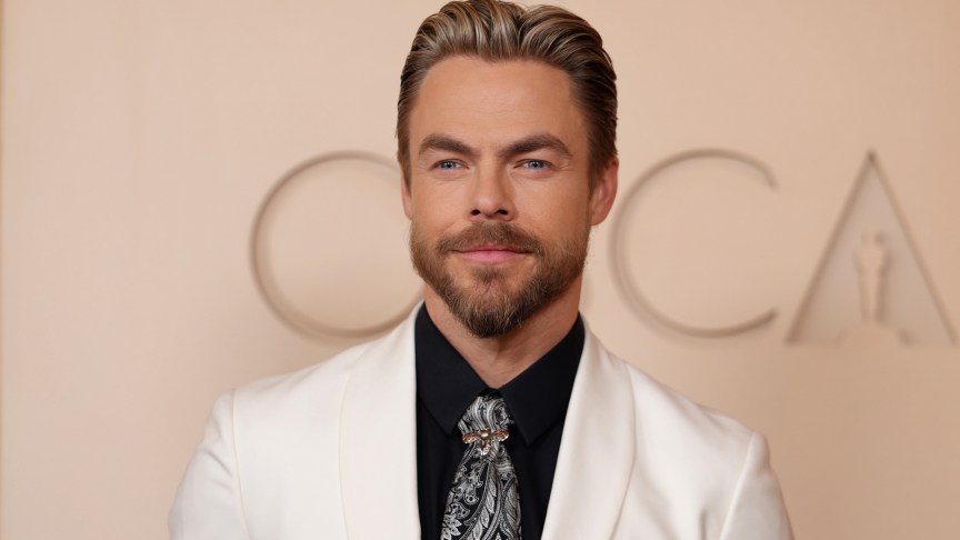 Derek Hough poses for photos at the 2026 Oscars