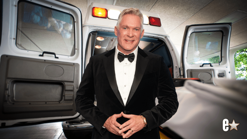 Sam Champion smiling at an event