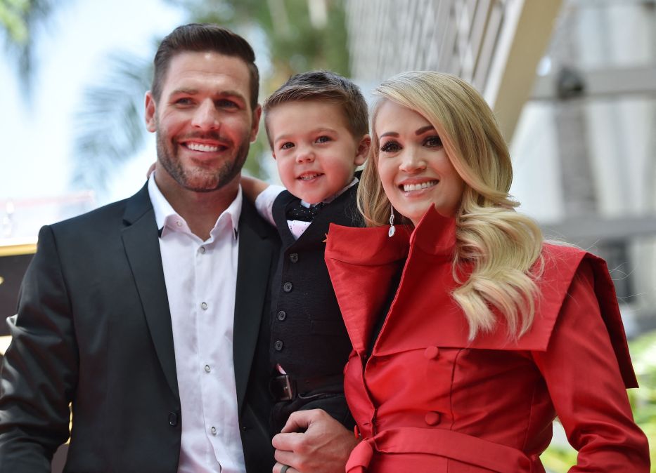 Mike Fisher and Carrie Underwood with their son