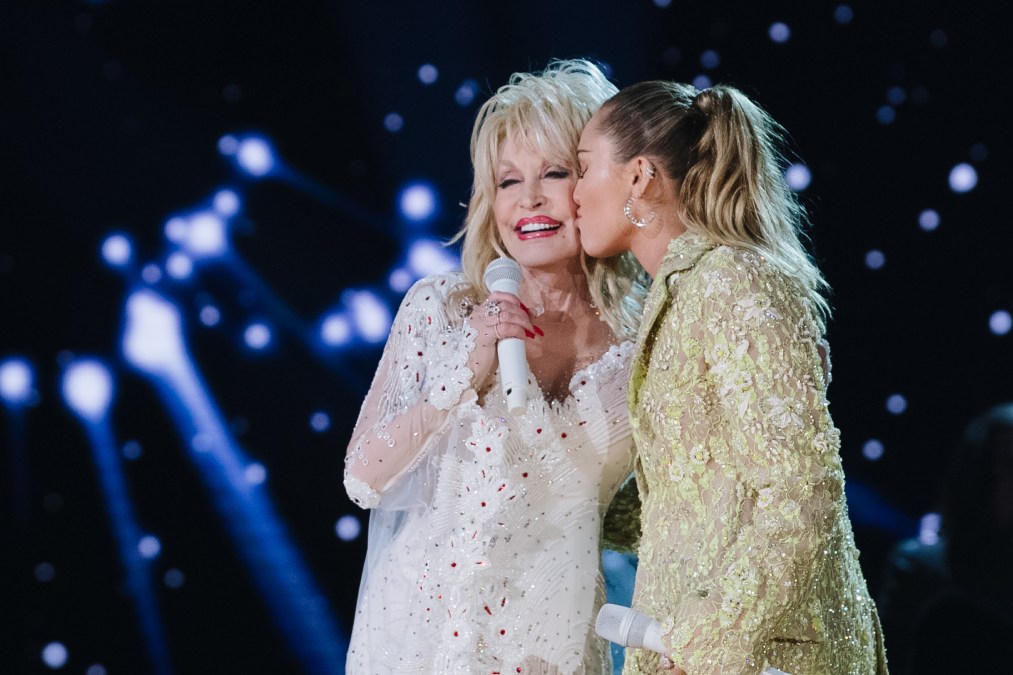 Dolly Parton and Miley Cyrus perform onstage at the 61st annual GRAMMY Awards.