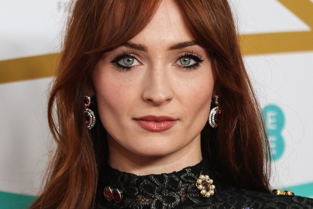 British actress Sophie Turner poses on the red carpet upon arrival at the BAFTA British Academy Film Awards