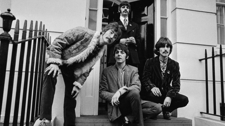 Beatles waiting infront of their mangers house