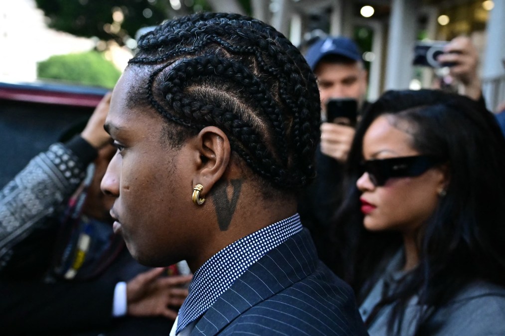 Barbadian singer Rihanna (R) and Rakim Mayers (L), aka A$AP Rocky, leave the Clara Shortridge Foltz Criminal Justice Center