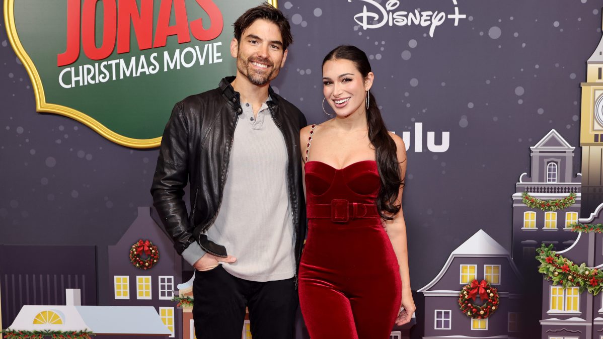 Ashley Iaconetti and husband Jared Haibon pose together on the red carpet