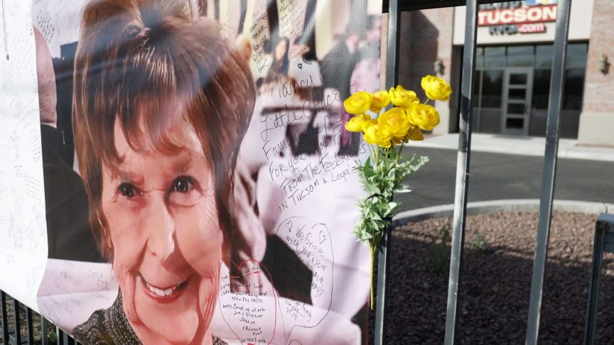 A photograph of Nancy Guthrie is displayed on a banner