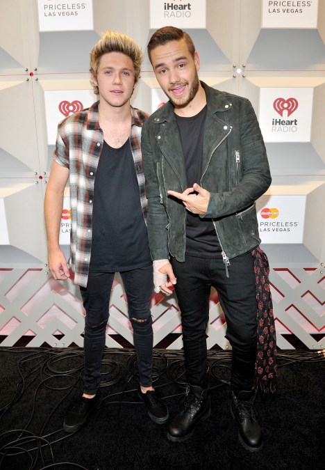 Recording artists Niall Horan and Liam Payne of One Direction pose in the press room during the 2014 iHeartRadio Music Festival