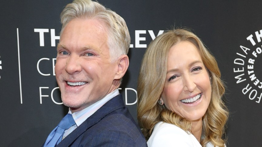 Sam Champion and Lara Spencer smiling for a photo at an event