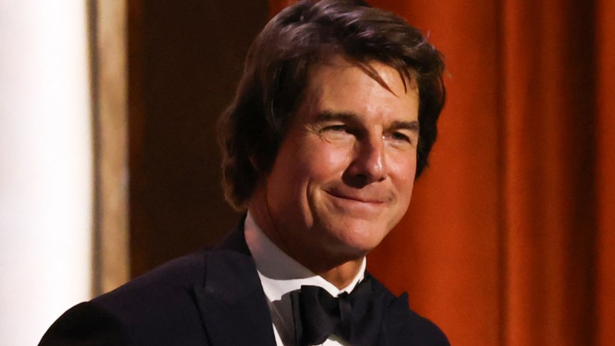 Tom Cruise smiling at a film event