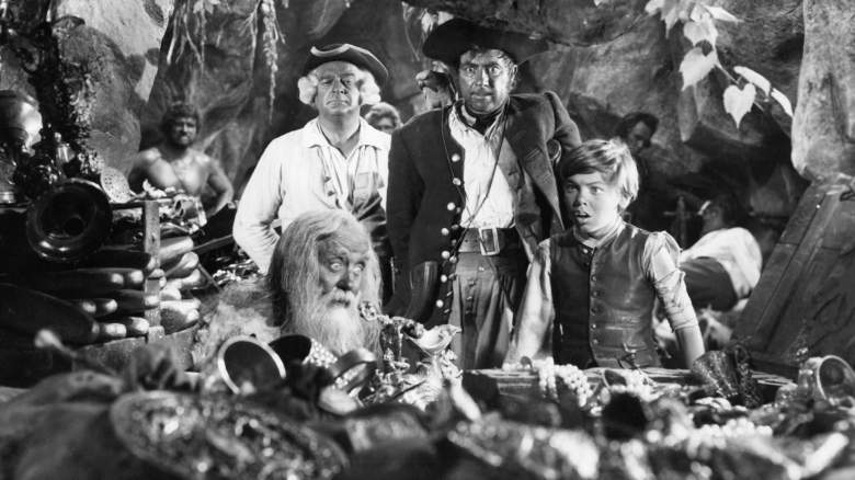 Bobby Driscoll and other stars in a scene from scene from "Treasure Island"