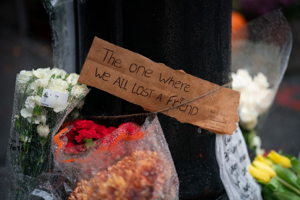 Floral tributes are left for actor Matthew Perry outside the apartment building which was used as the exterior shot in the TV show "Friends"