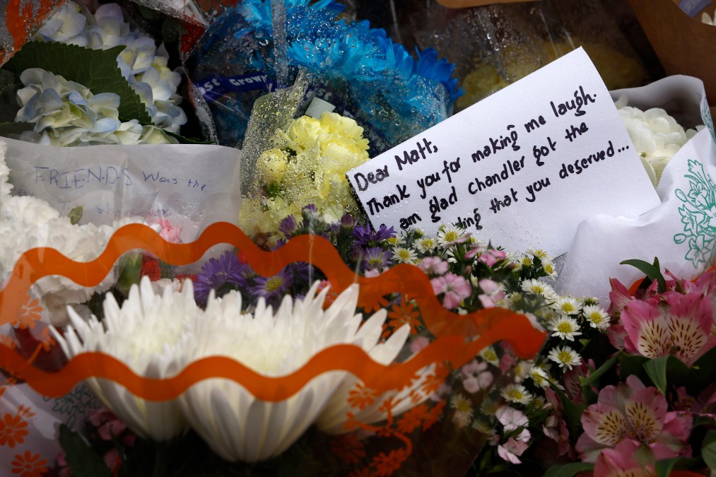 Fans Pay Tribute To Late Actor Matthew Perry Outside "Friends" Building In New York City