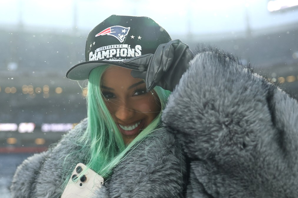 Cardi B poses for a photo following the AFC Championship Playoff game.