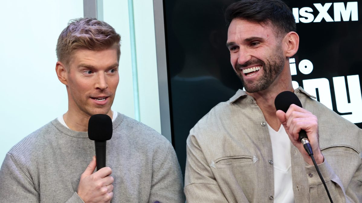 Kyle Cooke and Carl Radke speak into microphones during a SiriusXM “Summer House” event in New York City