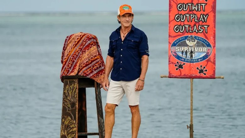 Jeff Probst standing beside a Survivor challenge setup in Fiji during Season 50
