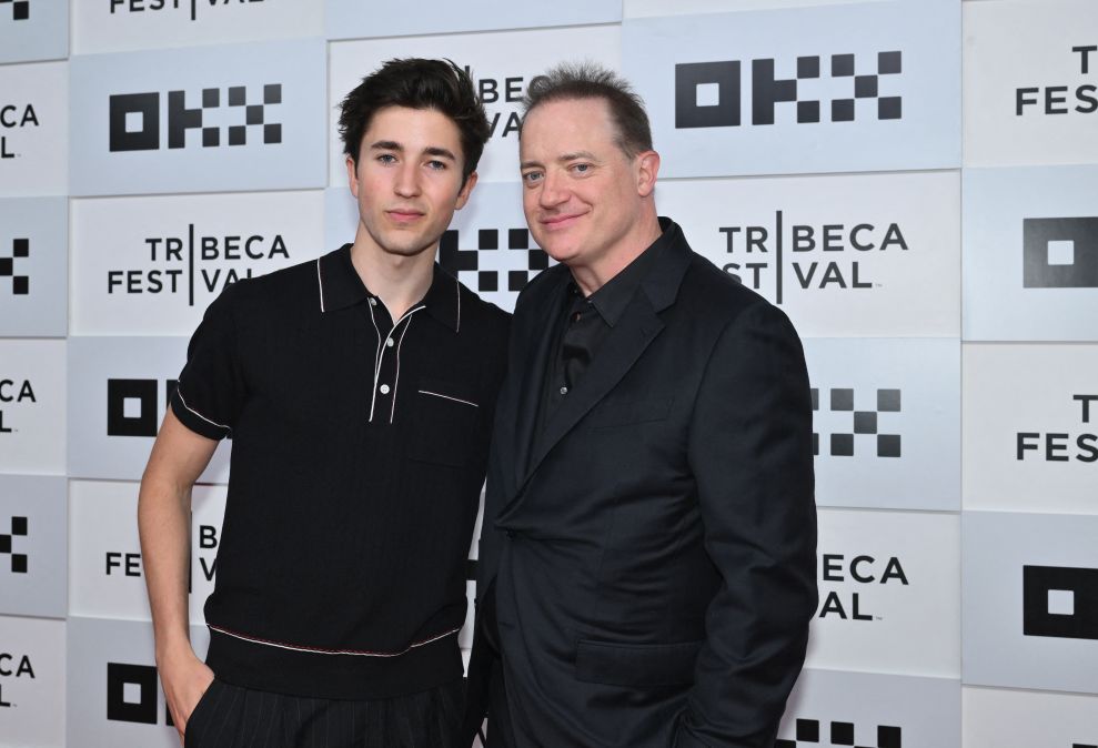 Brendan Fraser poses with his son at an event